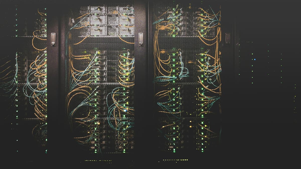 Server racks with dense network cabling and status lights